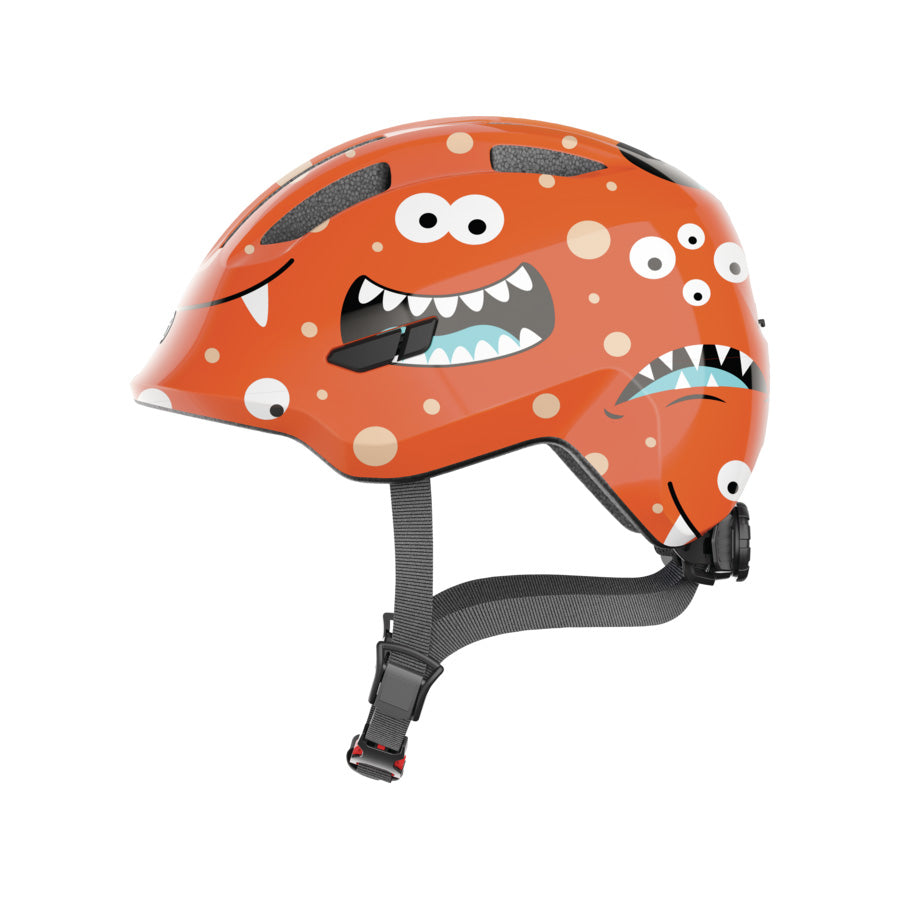 CASQUE ENFANT BABY ABUS SMILEY 3.0 ORANGE MONSTER IN MOLD AVEC REGLAGEOCCIPITAL T.S 45/50